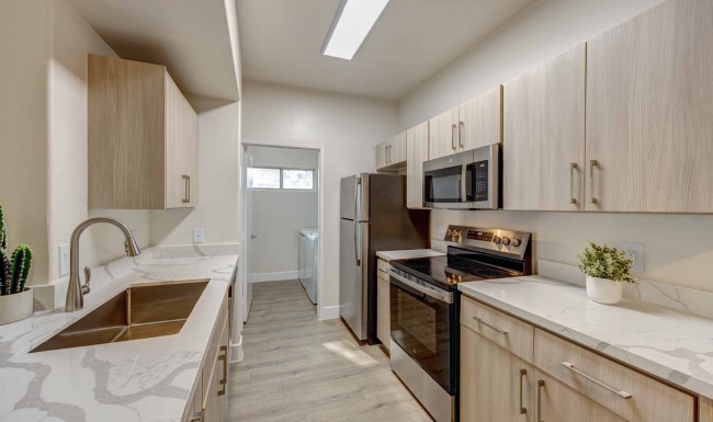 a kitchen with white cabinets